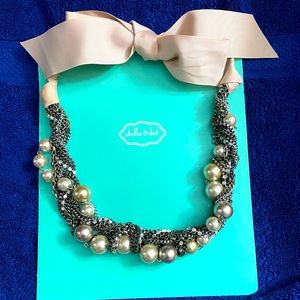 Stella & Dot Necklace;twisted metal chains and pearls,fastens with a pink ribbon